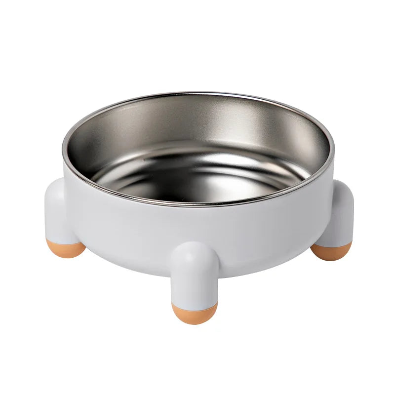 Gamelle pour chien blanche au style minimaliste avec quatre pieds ronds et bol en acier inoxydable.
