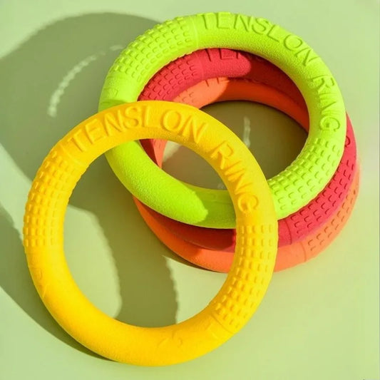 Jouet volant AeroTruffe™ en mousse TPR pour chien, couleurs jaune, rose et vert, idéal pour lancer et rapporter.